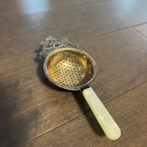 Antique Silver pleated Tea Strainer with Cream Handle
